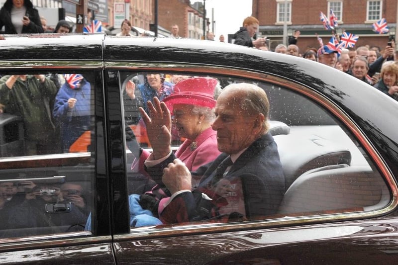 And off they go ... The Queen and Prince Philip leaving following their visit to Heinz in Kitt Green