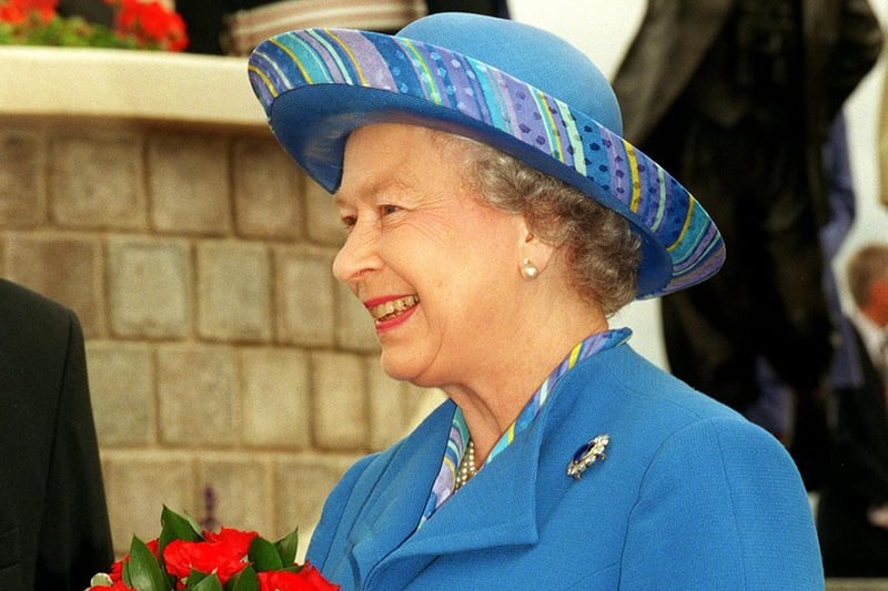 The Queen with a bunch of flowers at the unveiling of the Eric Morecambe statue in 1999.