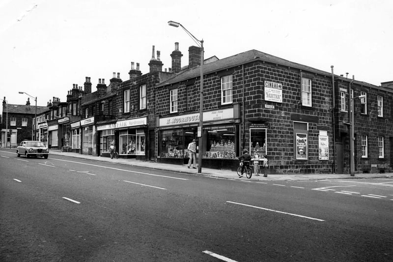June 1980 and pictured is Otley Road showing the junction with Cottage Road on the right. Shops include H. Moorhouse, grocers, Mayfair Fashions and J. C. Cook, butcher.