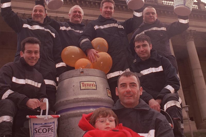 April 1999 and charity barrel pushers from Bramley Fire Station set off from Leeds Town Hall to raise funds for young Hope Salter, pictured with fire officer Paul Reynolds.