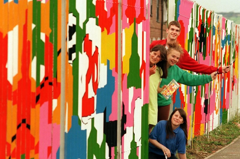 Teenagers from Fairfield Youth Centre were painting a mural on the fence surrounding their building Pictured, left to right, are Shantell Dixon (bottom), Danielle Dixon, Lisa Partridge and Craig Croft.