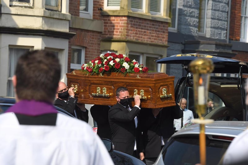 Mrs Lofhouse's coffin is carried to the car
