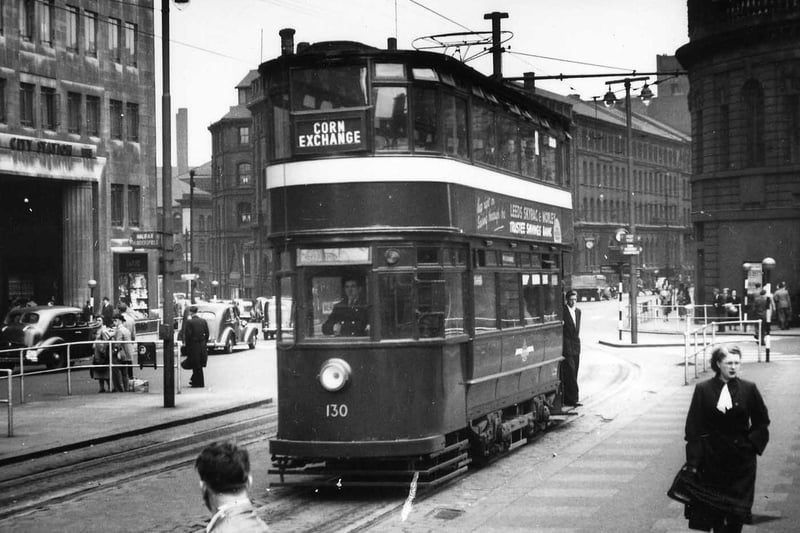 Chamberlain tram no.130 passing through City Square on its way to the Corn Exchange in July 1952. On the left is part of the Queen's Hotel which includes an entrance to the City Station. On the right is the Majestic Cinema.