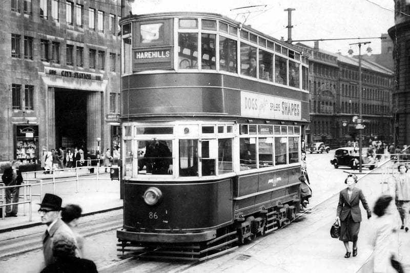 Tram number 86 in City Square destination Harehills. Pictured in July 1952. In the background to the left of the tram the entrance to Leeds City Station is visible.
