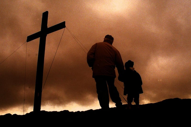 Storm clouds gather over the symbolic Cross on Otley Chevin in April 1998.