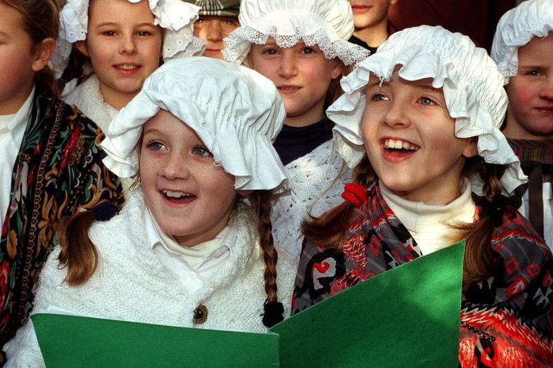 Otley Victorian Fayre in December 1998. Young carol siners from Bramhope Primary School entertained shoppers at New Inn Court.