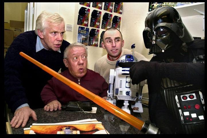 Star Wars legends Jeremy Bullock, left, who played bounty hunter Boba Fett, and Kenny Baker who played robot R2D2 meet old adversary Darth Vader at the opening of a new sci-fi shop, Yesterday's Yubnub, owned by Ian Clarke in Fleet Street, Pemberton, on Saturday 20th of March 2004