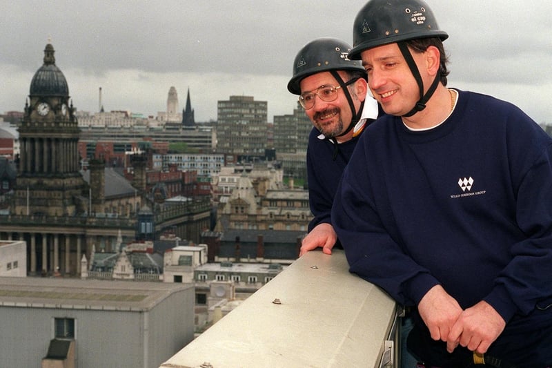 Businessmen Richard Bell (left) and Sean Hicks, look to the ground before their charity abseil down the Royal & SunAlliance building in April 1998.