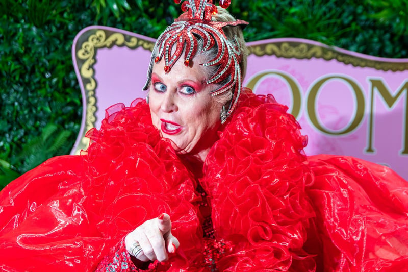 TV personality Kim Woodburn smouldering in red for the launch of adult panto Aladdin and his Magic Ring