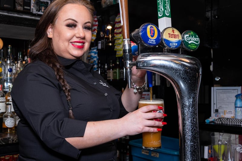 Caitlin Povey pours a pint at The Lord Nelson.