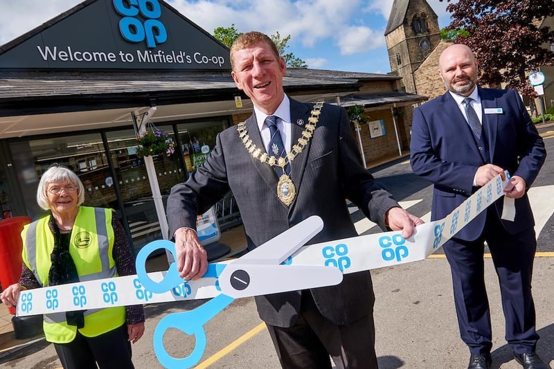 Ruth Edwards, from Mirfield in Bloom; Coun Martyn Bolt, Mayor of Mirfield; and John Marsh, store manager, at the new-look Mirfield Co-op and Post Office