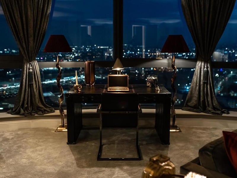 Guests and owners can enjoy a magnificent view of the skyline while working from their desk in the living room.
