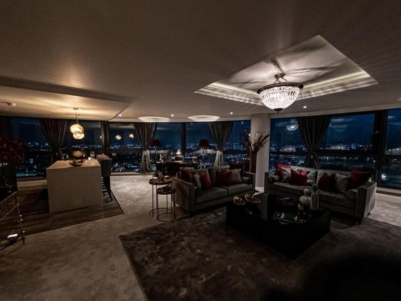 The living room and kitchen has a large panoramic window which offers a 180 degree view of the city.