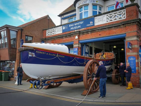 The boat is pulled from the museum.