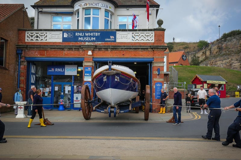 Crew pull the Robert & Ellen Robson out of the lifeboat museum.