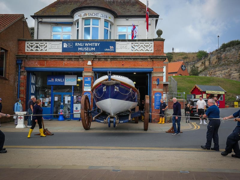 Crew pull the Robert & Ellen Robson out of the lifeboat museum.