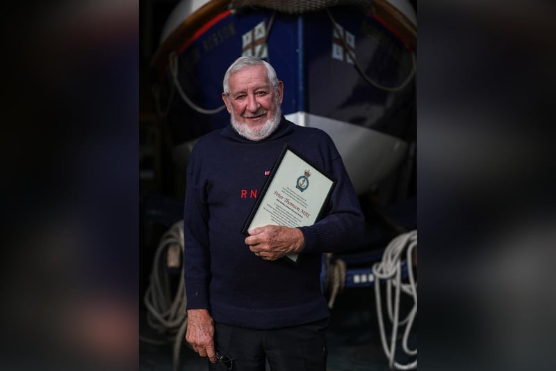 Former coxswain and museum curator, Pete Thomson MBE, with his certificate of thanks from the RNLI.