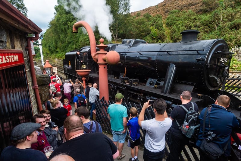 Crowds gather to photograph an engine