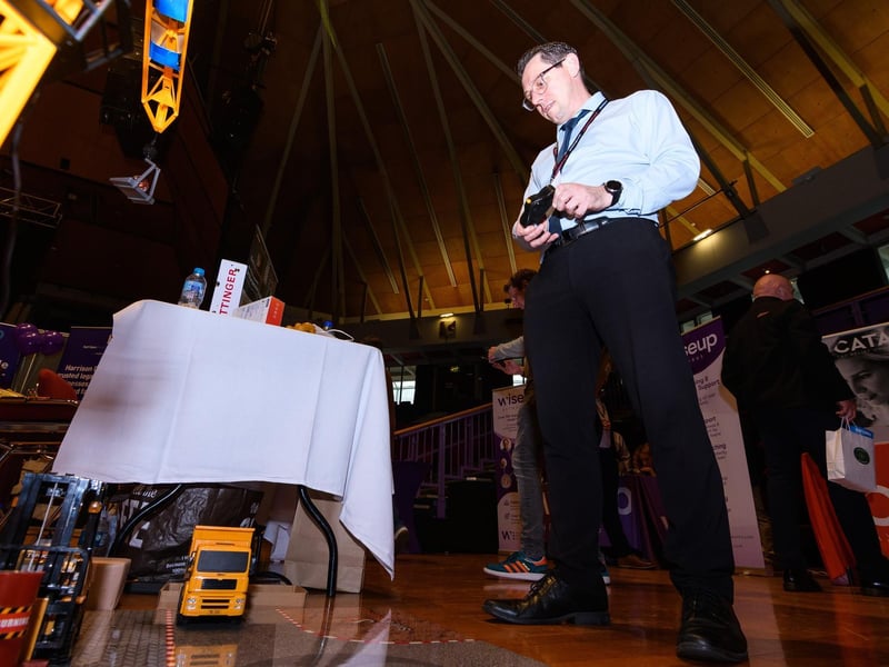 Russ Lord from Copy Print Services tries out a logistics challenge from Safe and Insured at Lancashire Business Expo
