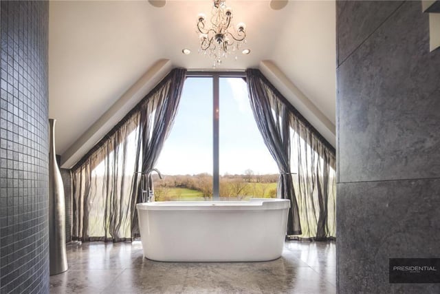 This bath has rural views plus voiles for privacy if needed