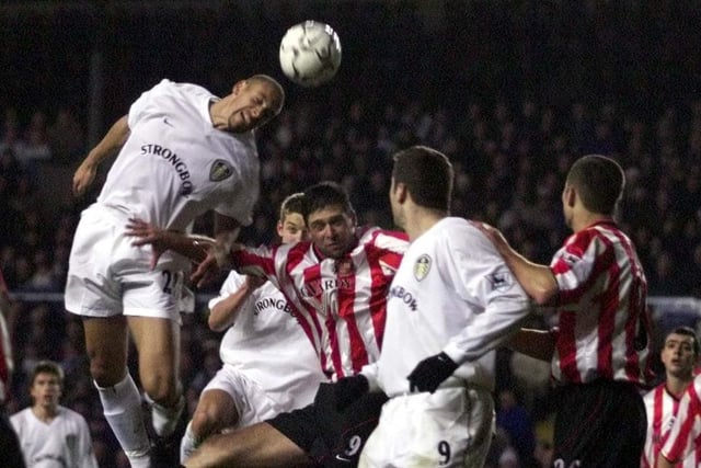 Rio Ferdinand rises high to clear the ball. PIC: Varley Picture Agency