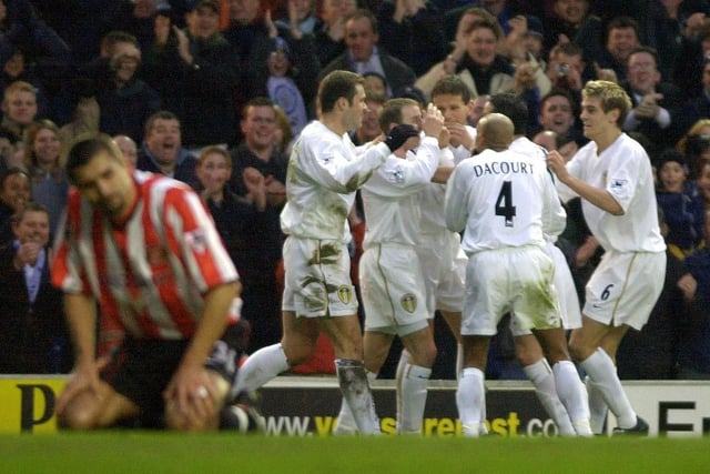 Lee Bowyer celebrates with his teammates after putting Leeds United ahead. PIC: John Giles/PA