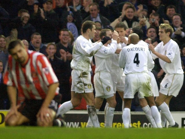 Lee Bowyer celebrates with his teammates after putting Leeds United ahead. PIC: John Giles/PA