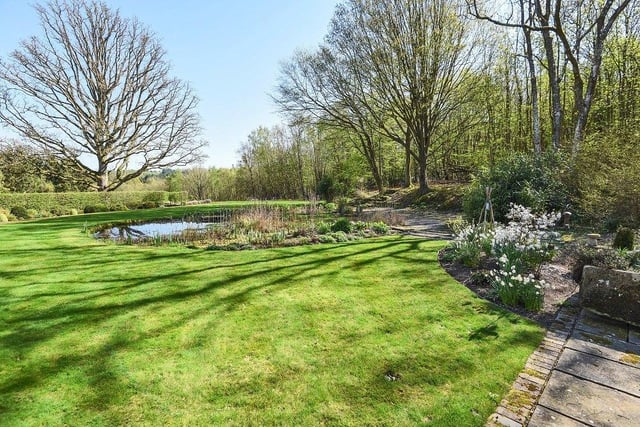 About 15 acres of gardens & grounds plus a 50% share of 75 acres of land.