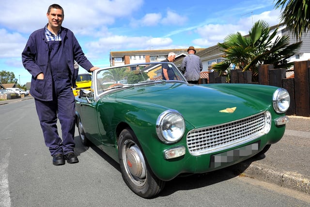 Peter Hawkins and his 1964 Austin Healey Sprite. Enthusiasts turnout as a steamroller leaves Glenwood Estate for first time in 50 years. Pic Steve Robards SR2007182 SUS-200718-164608001