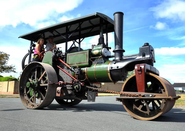 Tim and Tarina Walters in their 1926 steam engine called "Rattler"Enthusiasts turnout as a steamroller leaves Glenwood Estate for first time in 50 years. Pic Steve Robards SR2007182 SUS-200718-164526001