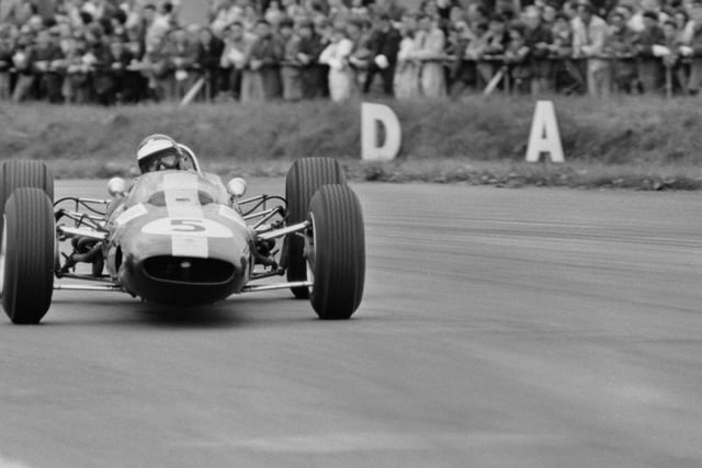 The legendary Jim Clark goes sideways in his Lotus 33 during the 1965 race at Silverstone  one of the Scot's six wins that year on his way to the world title.