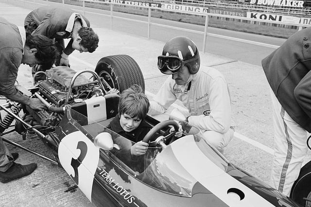Graham Hill lets son, future world F1 champion Damon, try out his Lotus before the 1967 GP at Silverstone. Hill retired from a race won by Scottish legend Jim Clark, who was tragically killed at Hockenheim nine months later