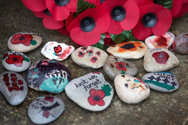 Pebbles left among the wreaths at the Selsey War Memorial. Photo: Chris Hatton SUS-200911-180902001