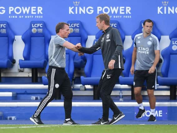 Brighton and Hove Albion head coach Graham Potter with Leicester boss Brendan Rodgers