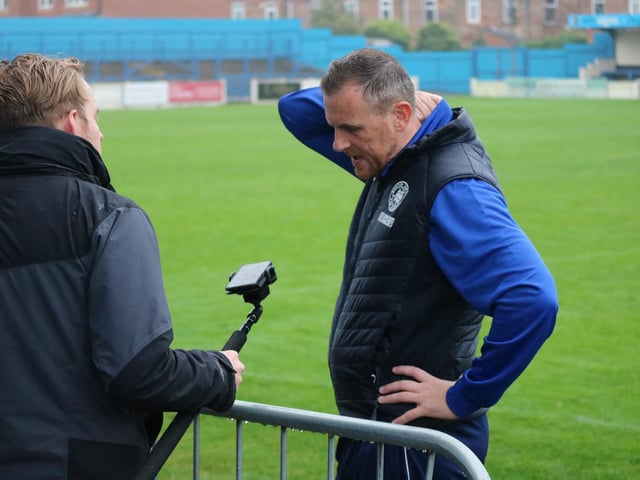 A post-match interview between the Covid zones. Photo: Oliver Atkin
