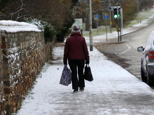 A woman walking on London Road