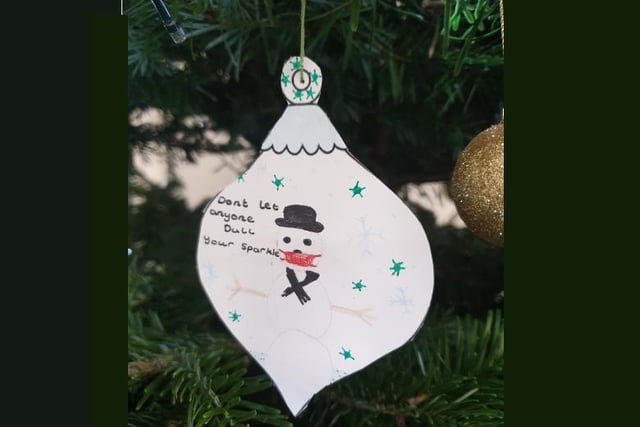 Students wrote messages on baubles for the 'kindness tree'