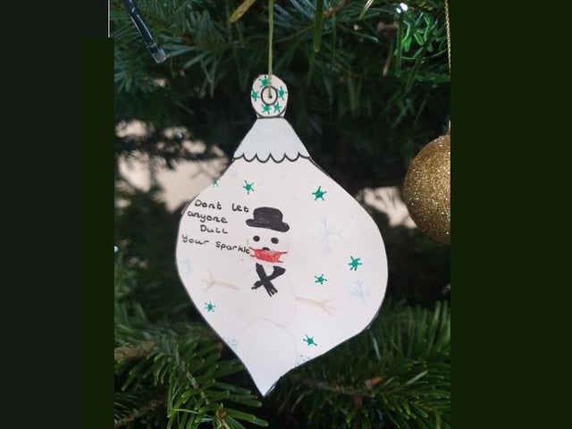Students wrote messages on baubles for the 'kindness tree'
