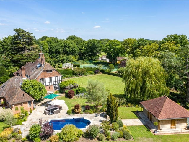 A beautifully presented country house, set in around 17 acres of grounds and paddocks, with formal gardens, equestrian facilities and self-contained annexe. Price: £3,750,000.
