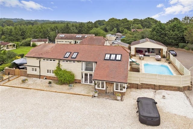 Beautiful barn conversion set in 5.23 acres of grounds with outdoor swimming pool, gym, steam room, cinema and separate offices. Price: £2,500,000.