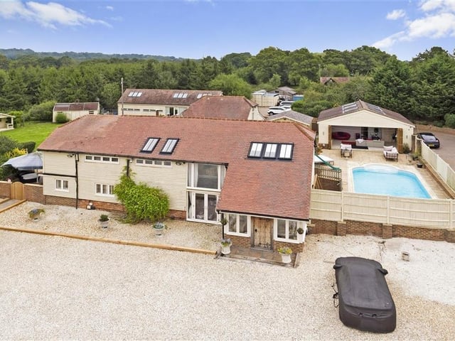 Beautiful barn conversion set in 5.23 acres of grounds with outdoor swimming pool, gym, steam room, cinema and separate offices. Price: £2,500,000.