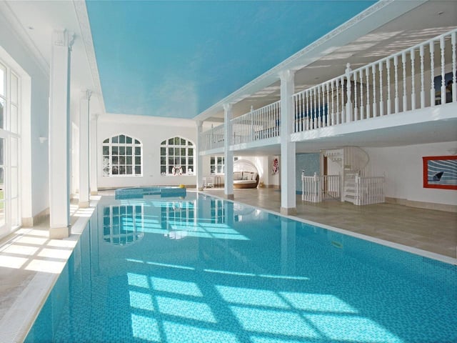 A prominent and very striking Grade II listed country house dating from about 1840. Price: Offers over £2,950,000.