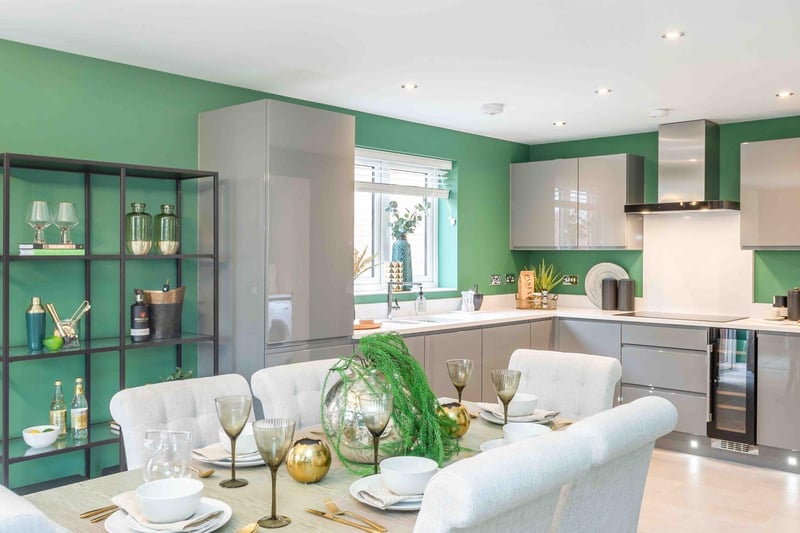 The kitchen is so light and bright it could afford to go bolder with the paint colours. The company opted for a green colour palette alongside the dusk grey-coloured cupboards, giving the kitchen a really natural, organic atmosphere.