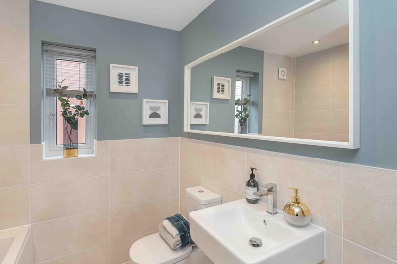 A bathroom should be comforting, warm and calming, and using soft tones like creams and pastel blues is a great way to achieve that.
To give the room some added brightness, we’ve included a horizontal mirror that will reflect the natural light from the window into the space.