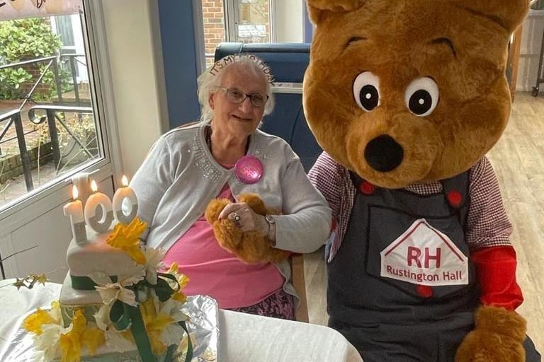 Lilian with her favourite teddy bear Rusty, Rustington Hall's mascot
