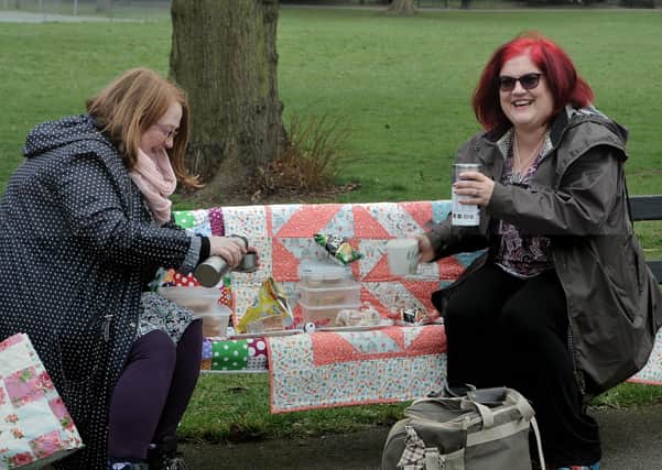 Julia Harrison (right) and Sarah Payne (left) meet up for the first time in a year for a small picnic.