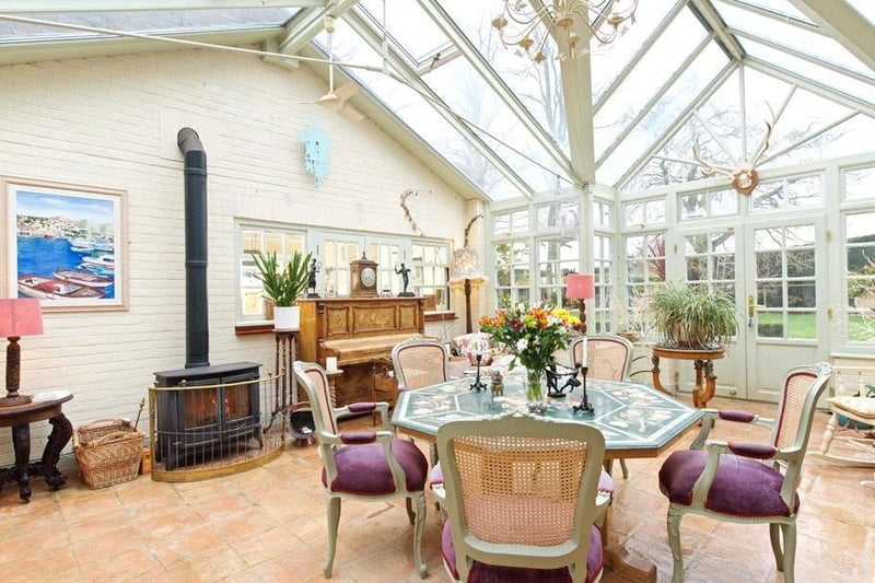 The spacious conservatory comes with a bespoke design, tiled rustic flooring and functioning log burning stove fireplace. Double doors lead to the dual aspect snooker room.