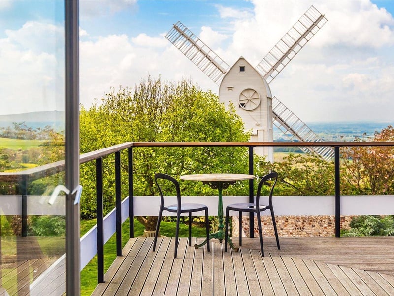 The Mill House's roof terrace with a view of Jill Windmill