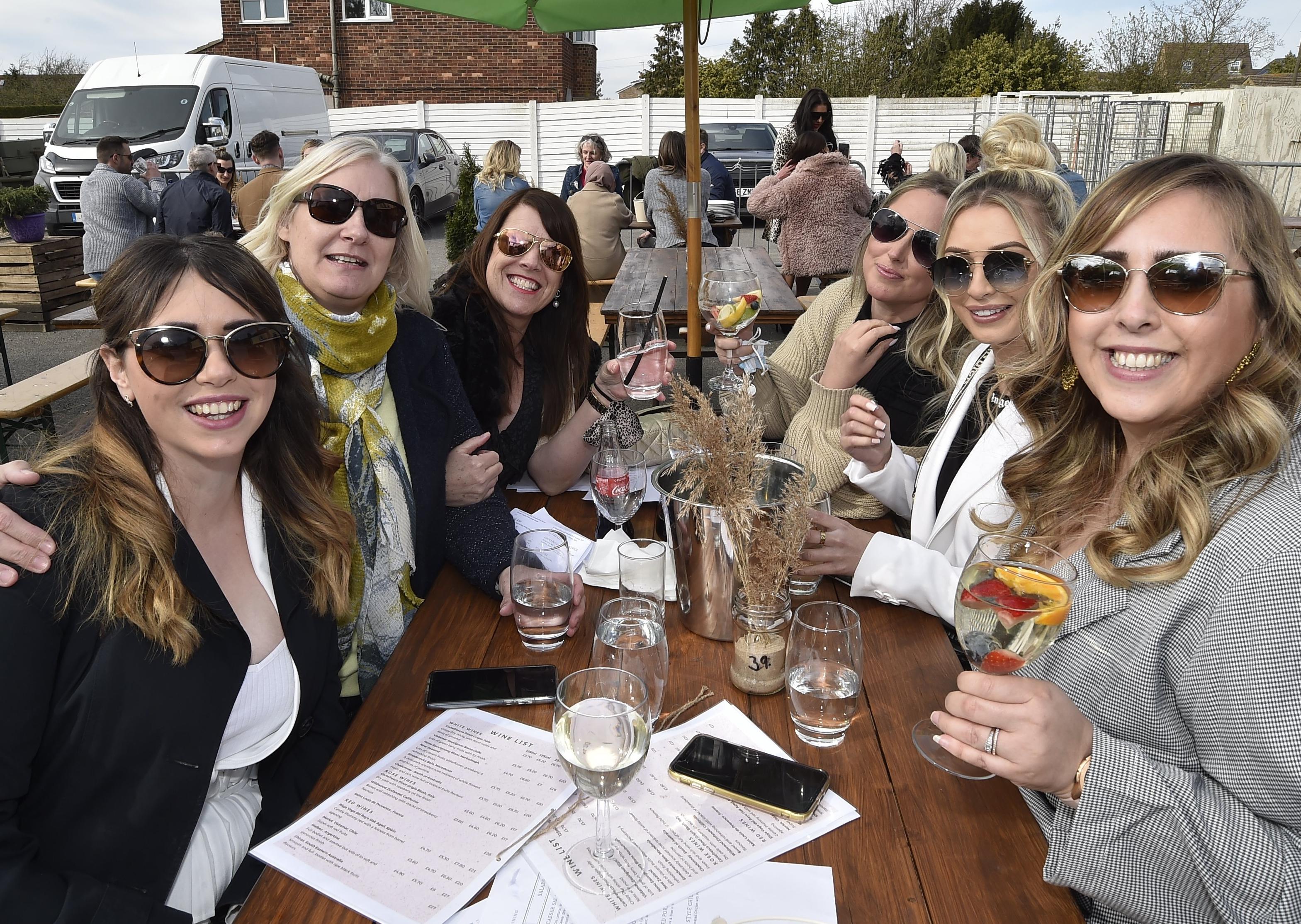 Warm sunny afternoon in the City  .  Customers at the House of Feasts , Eye EMN-210417-172703009