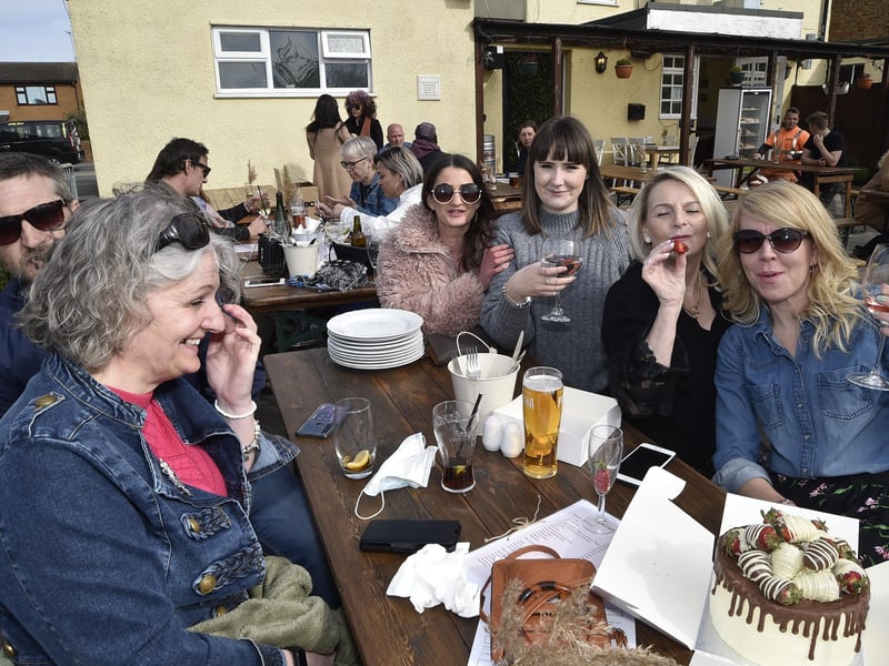 Warm sunny afternoon in the City  .  Customers at the House of Feasts , Eye EMN-210417-172626009